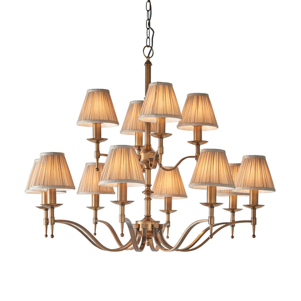 Stanford Twelve Light Pendant In Antique Brass With Beige Fabric Shades