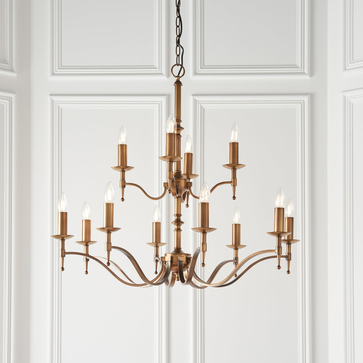 Stanford Twelve Light Pendant In Antique Brass With Beige Fabric Shades