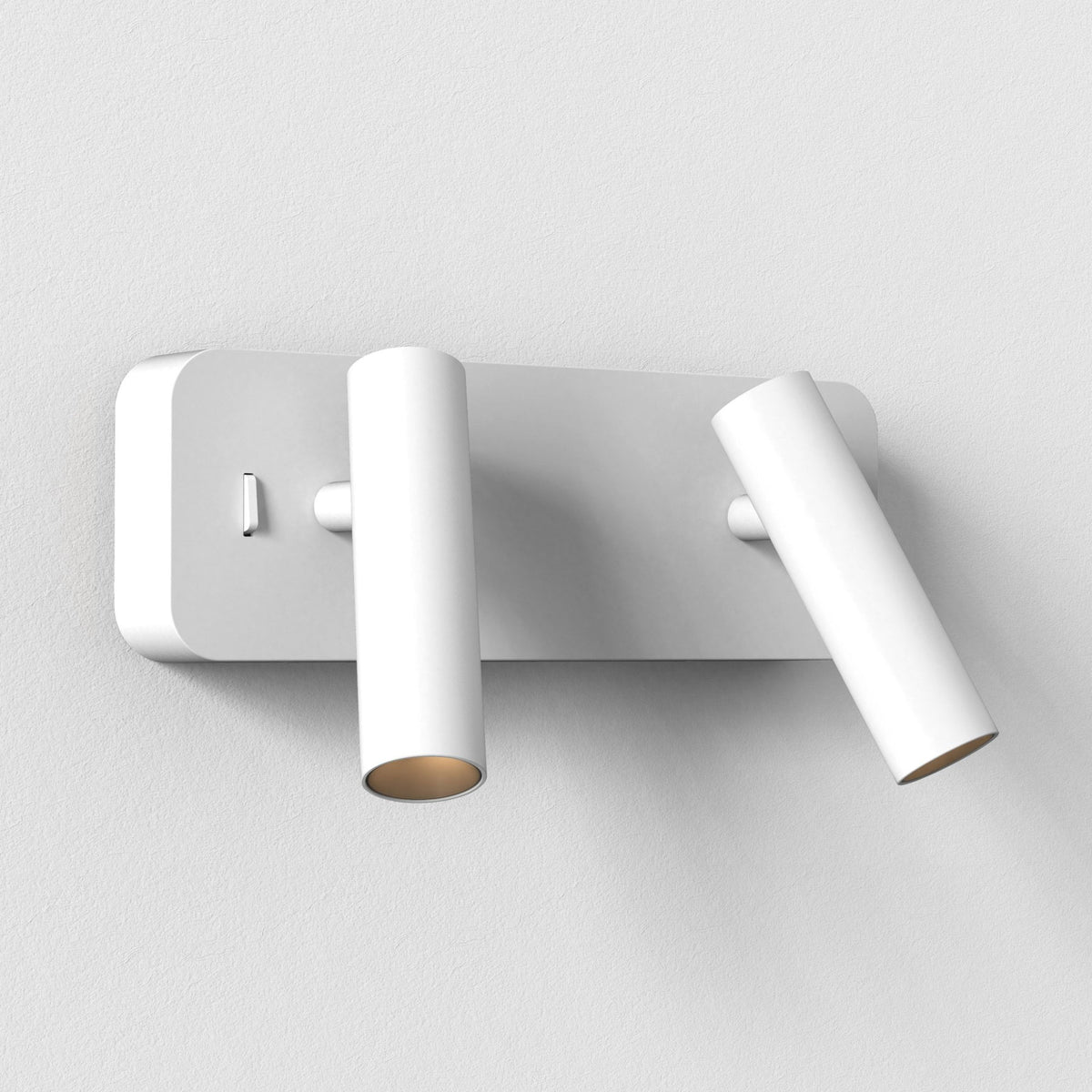 White wall light with two adjustable cylindrical spotlights, one pointing down, the other angled right