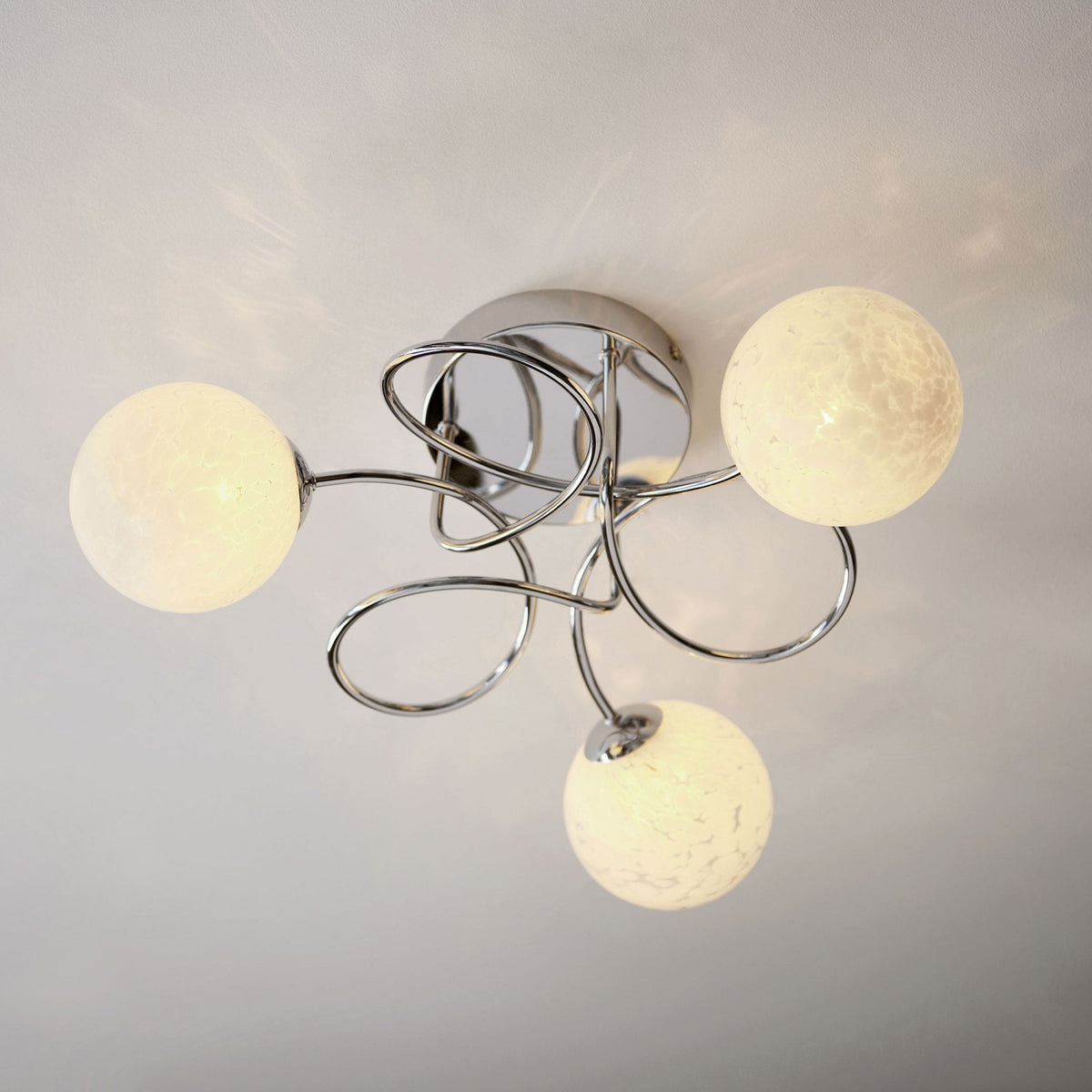 Delos Three Arm Ceiling Light in Polished Chrome with White Confetti Glass Shades