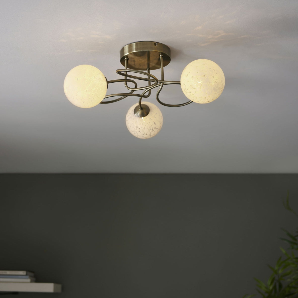 Delos Three Arm Ceiling Light in Antique Brass with White Confetti Glass Shades