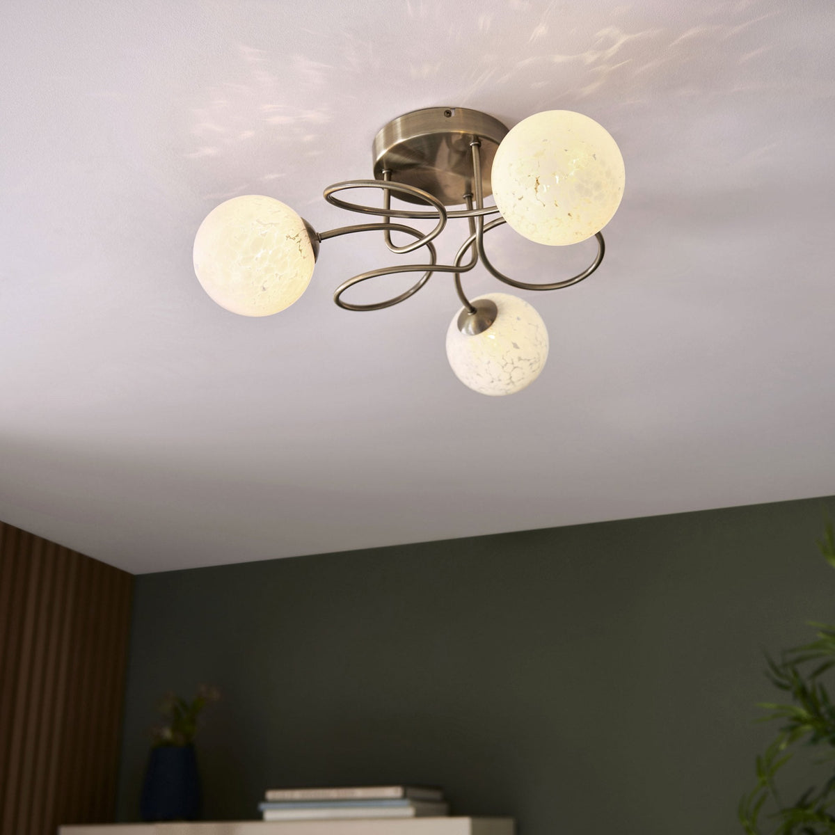 Delos Three Arm Ceiling Light in Antique Brass with White Confetti Glass Shades