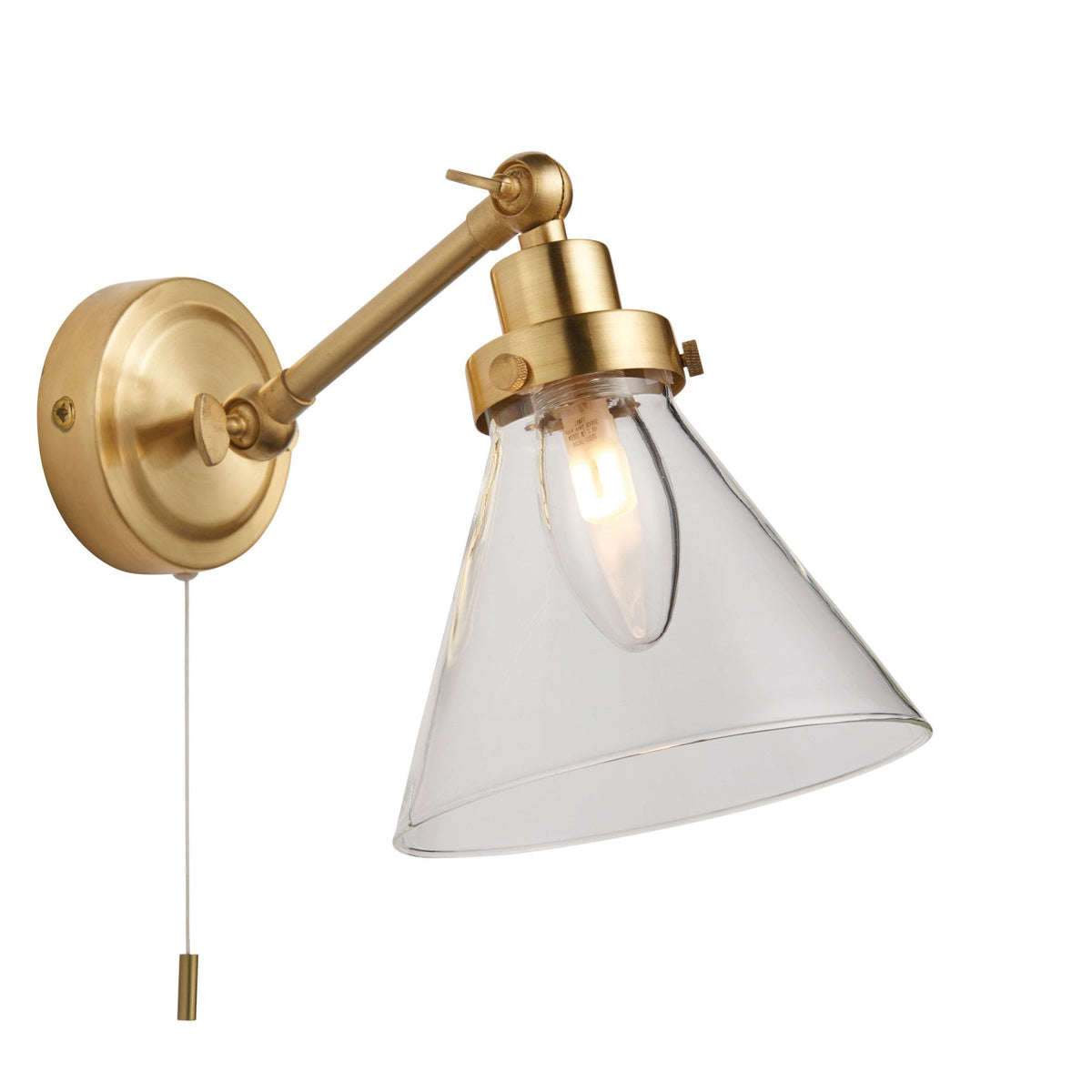 Brass wall light with an adjustable arm, clear glass cone shade, and a pull cord switch on a white background.