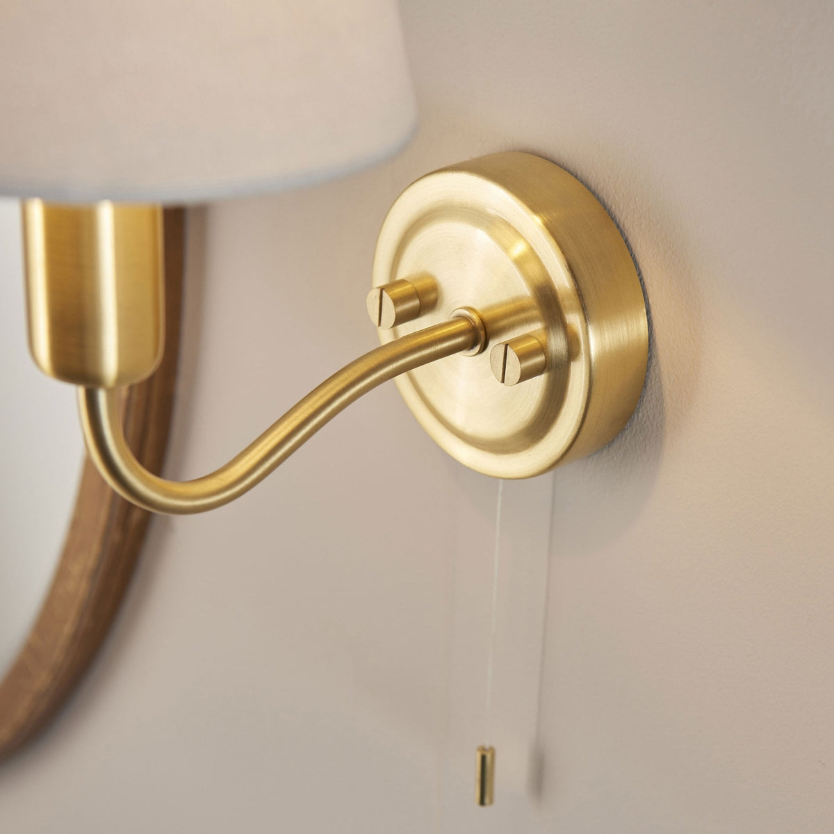 Conway Switched IP44 Bathroom Wall Light in Satin Brass with Ivory Fabric Shade