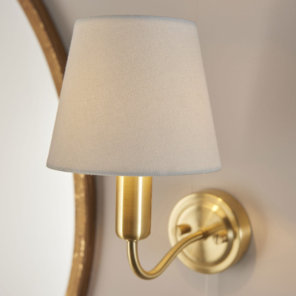 Conway Switched IP44 Bathroom Wall Light in Satin Brass with Ivory Fabric Shade