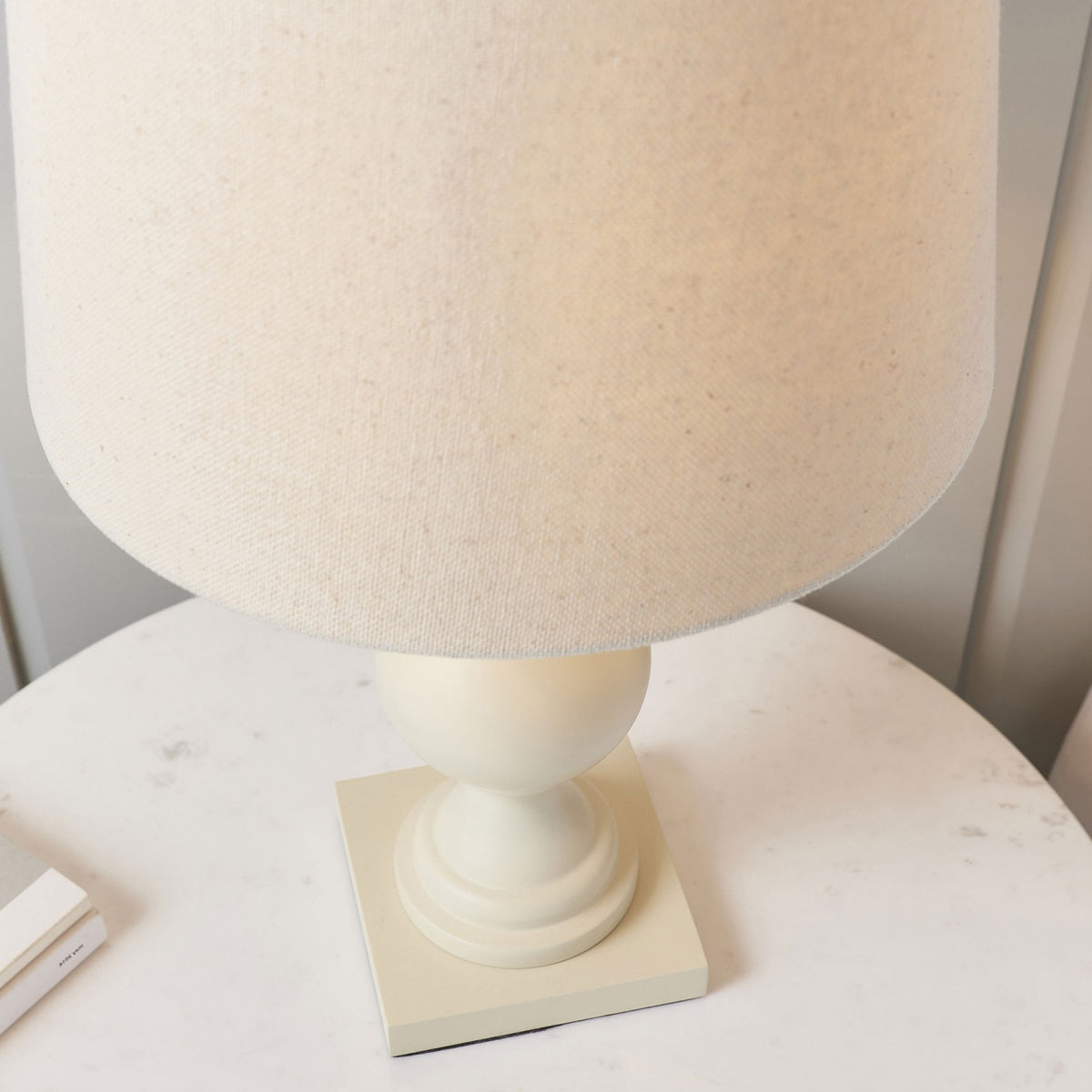 Top-down view of the cream table lamp with a linen shade.