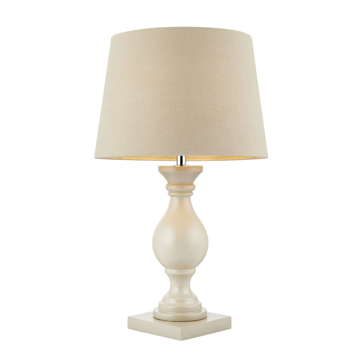 Cream table lamp with a linen shade, illuminated, on a white background.
