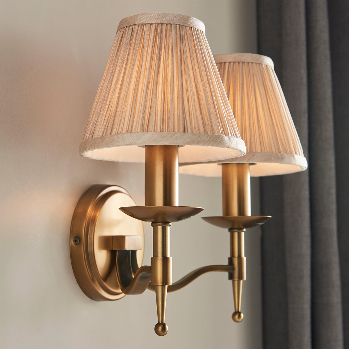 Stanford Twin Wall Light In Antique Brass With Beige Fabric Shade