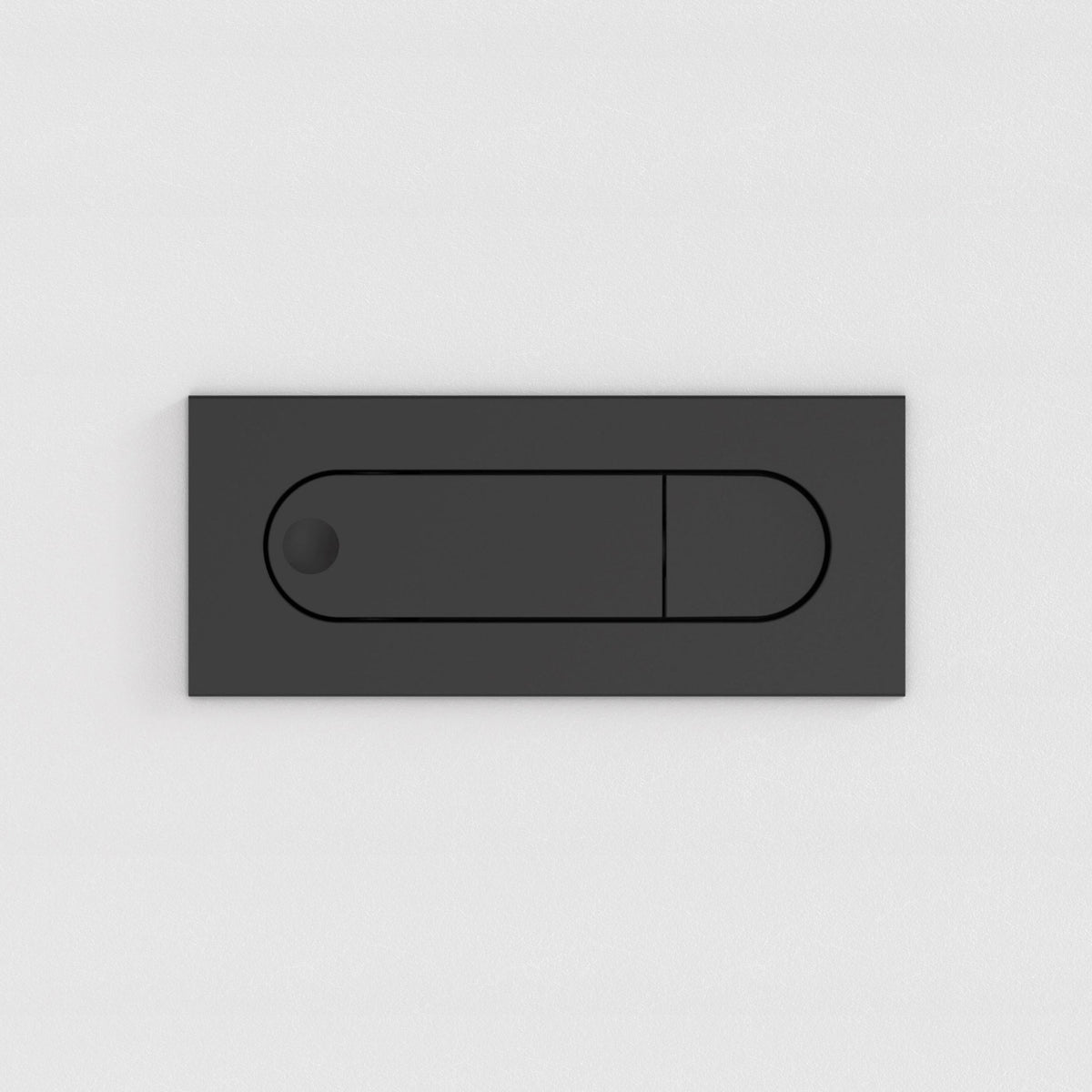 Black rectangular toilet flush plate with a circular button on the left and a larger rectangular button on the right