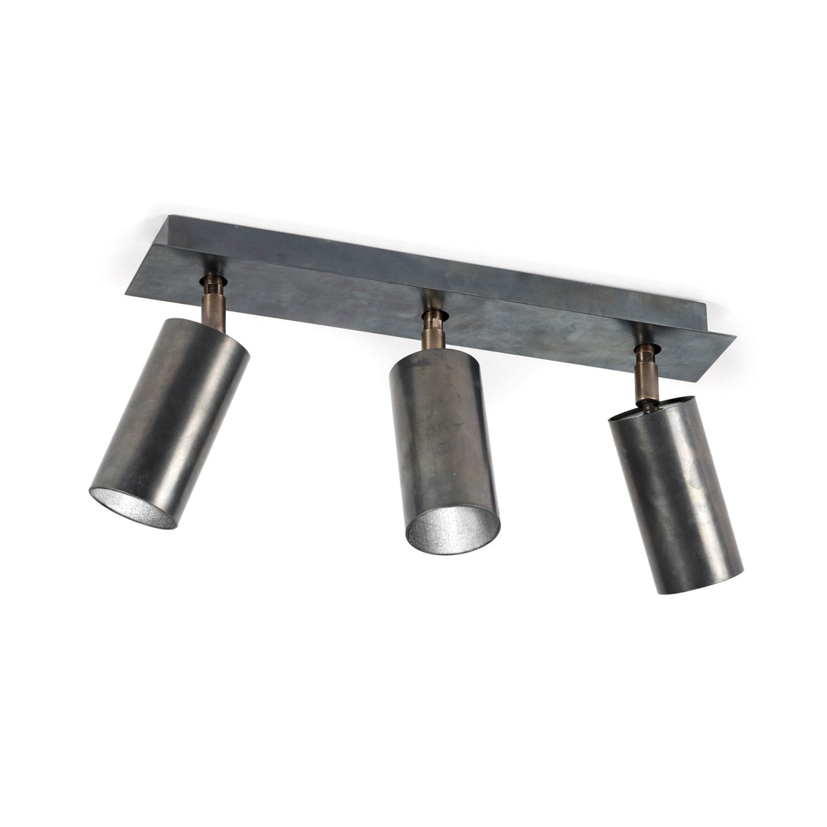A three-light spotlight bar in a stylish dark metal finish provides adaptable illumination.