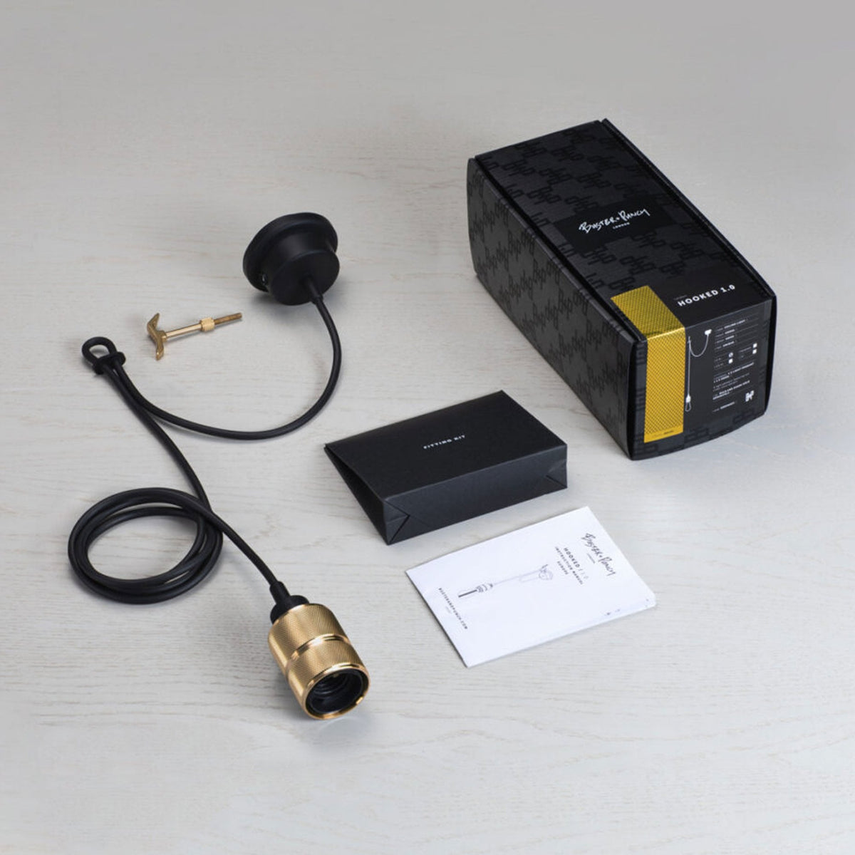 Hooked Nude Single Drop Pendant in Black and Brass Finish