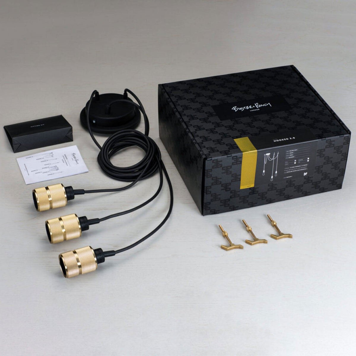 Hooked Nude Triple Drop Round Pendant in Black and Brass Finish