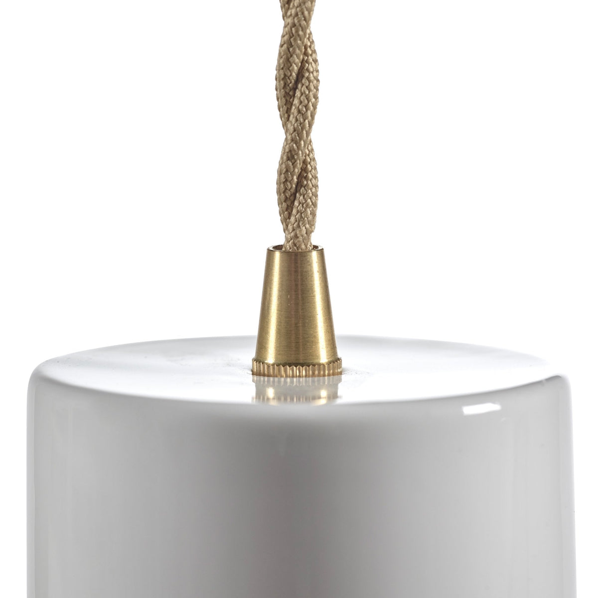 Close-up of the elegant brass fitting and braided cable on a white pendant light.