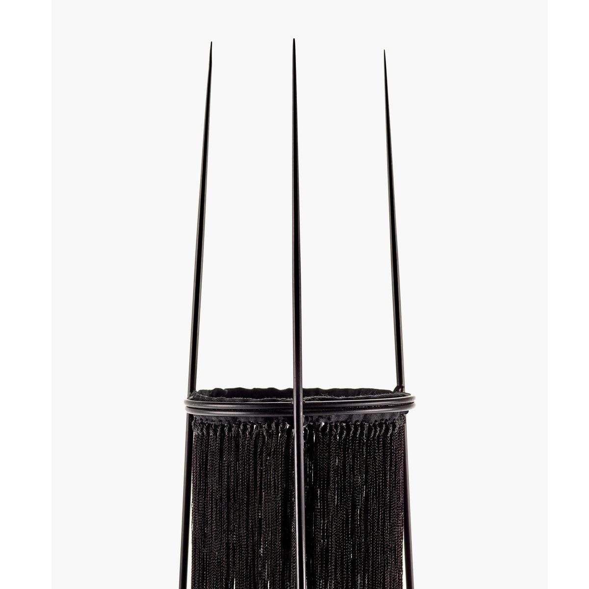 A close-up of the lamp's black top section and support structure.