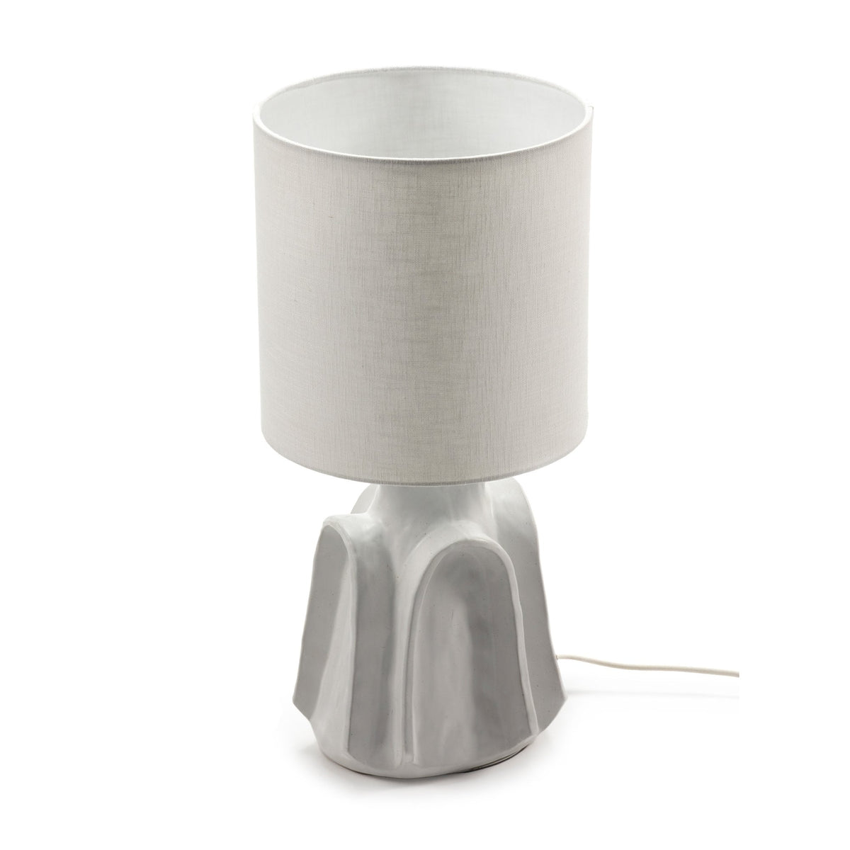 A white table lamp with a contemporary textured base and a plain cylindrical shade.