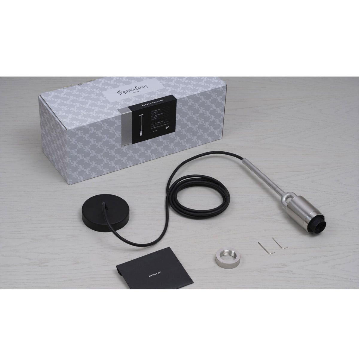 Buster + Punch pendant light kit with box, black cable, ceiling rose, and metal components.