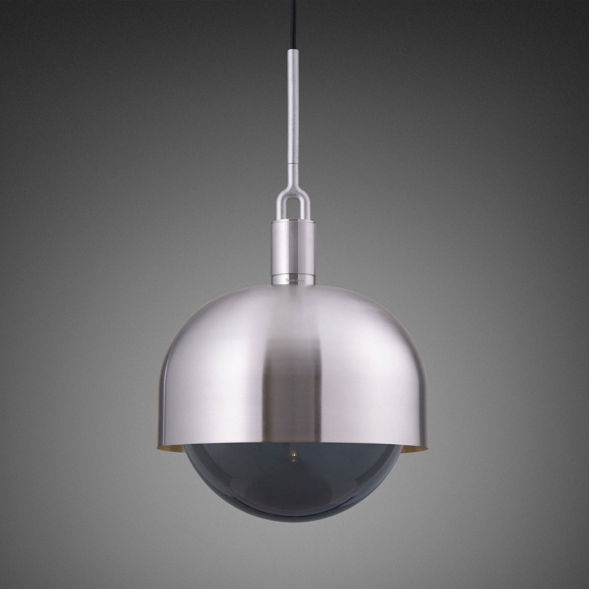 A modern brushed nickel pendant light with a domed shade and a dark, spherical glass diffuser.