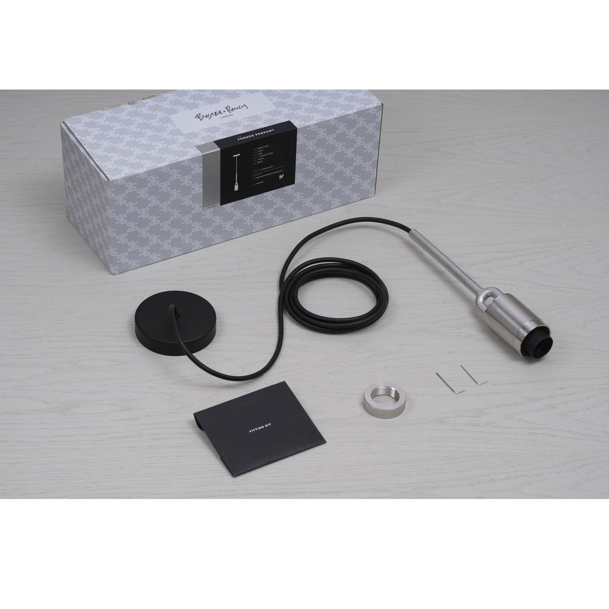 Buster + Punch Forked Pendant light kit with a box, black cable, and metal components.