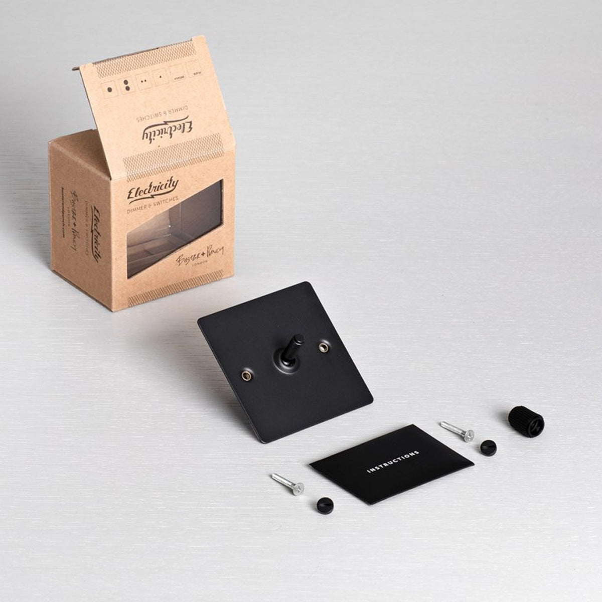 One Gang 2-Way Light Switch in Black & Brass with Knurled Toggle