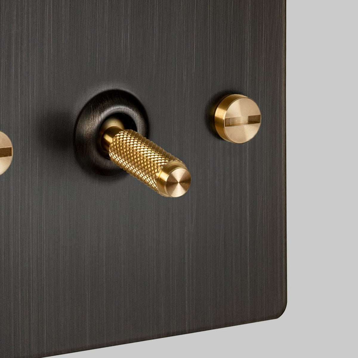 One Gang 2-Way Light Switch in Smoked Bronze & Brass with Knurled Toggle