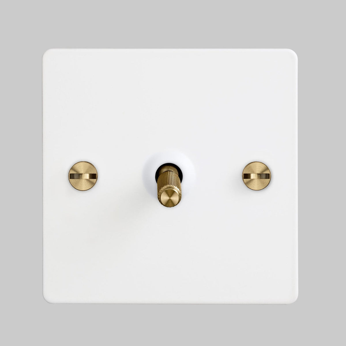 One Gang 2-Way Light Switch in White & Brass with Knurled Toggle