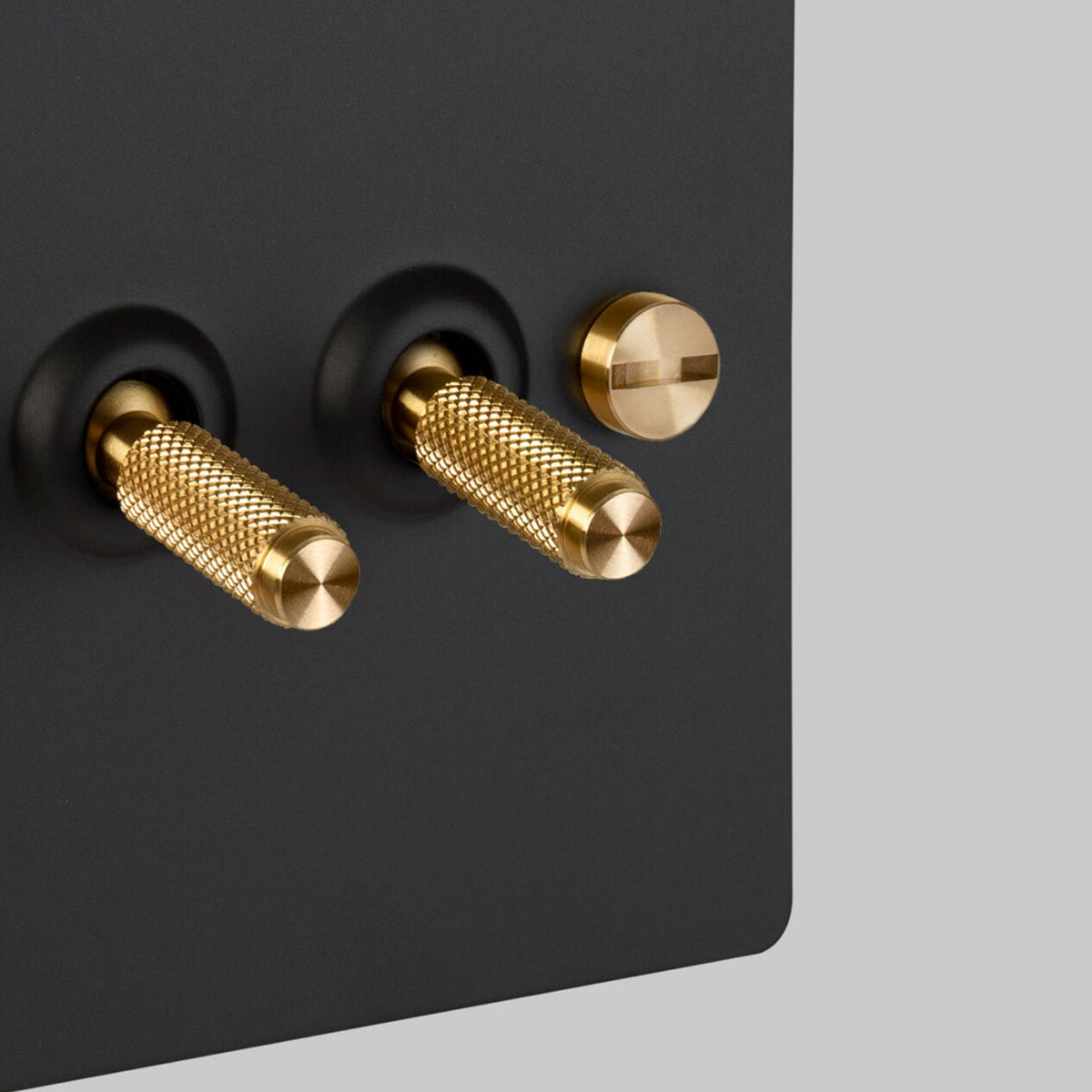 Two Gang 2-Way Light Switch in Black & Brass with Knurled Toggles