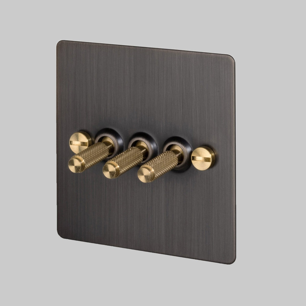 Three Gang 2-Way Light Switch in Smoked Bronze & Brass with Knurled Toggles