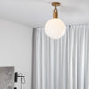 Forked Ceiling Light in a Brass Finish with Large Opal Globe