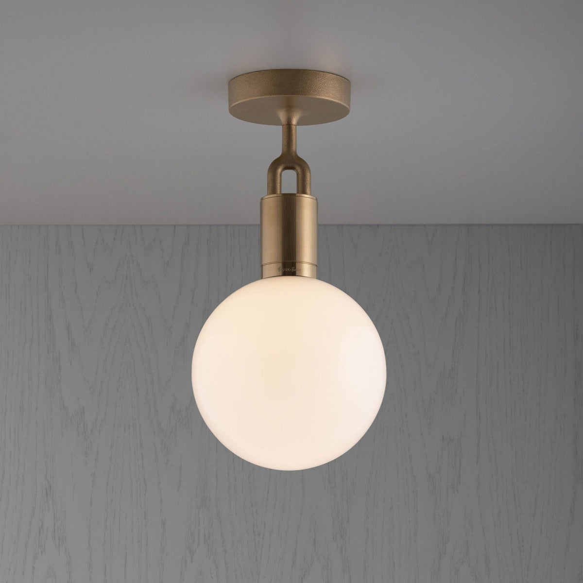 Forked Ceiling Light in a Brass Finish with Medium Opal Globe
