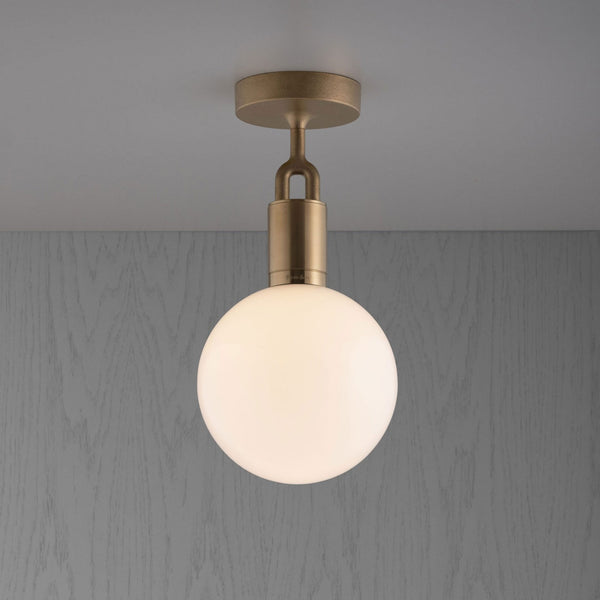 Forked Ceiling Light in a Brass Finish with Medium Opal Globe