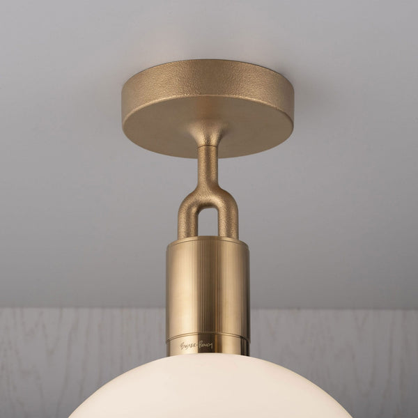 Forked Ceiling Light in a Brass Finish with Medium Opal Globe