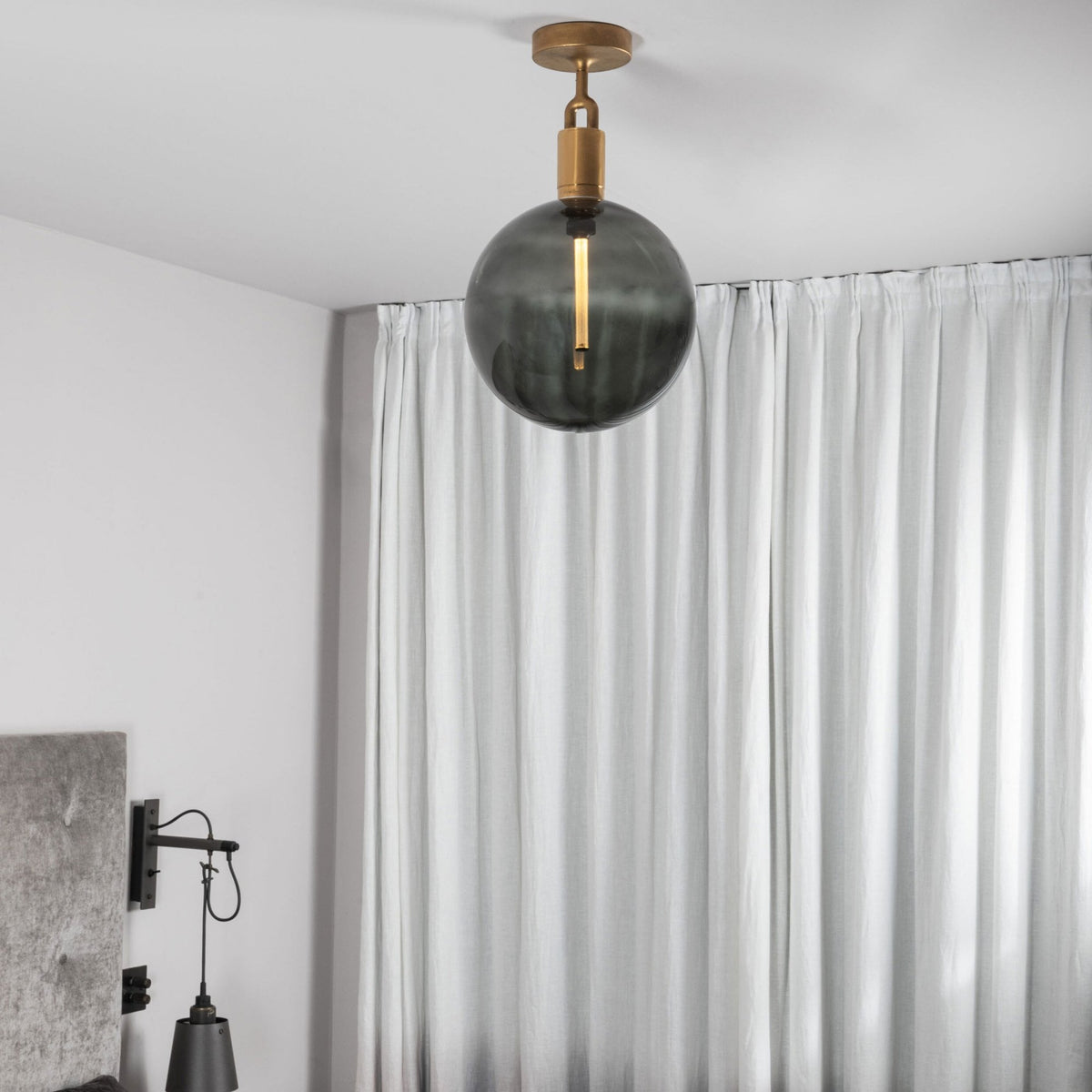 Forked Ceiling Light in a Brass Finish with Large Smoked Globe