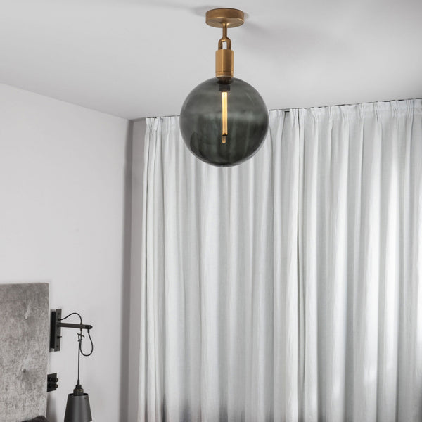 Forked Ceiling Light in a Brass Finish with Large Smoked Globe