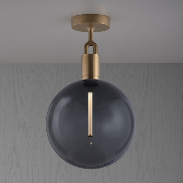 Forked Ceiling Light in a Brass Finish with Large Smoked Globe
