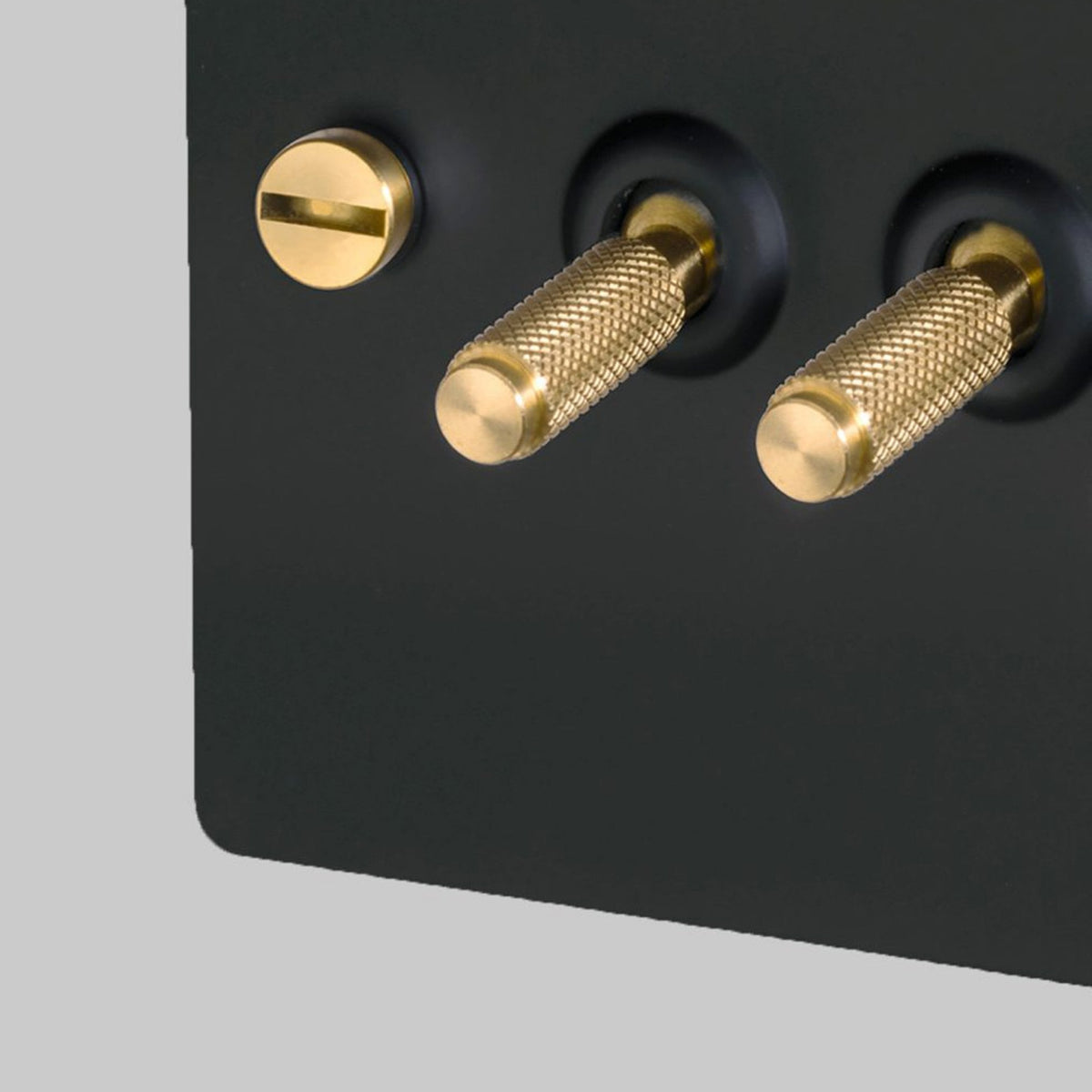 Four Gang 2-Way Light Switch in Black & Brass with Knurled Toggles