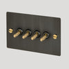 Four Gang 2-Way Light Switch in Smoked Bronze & Brass with Knurled Toggles