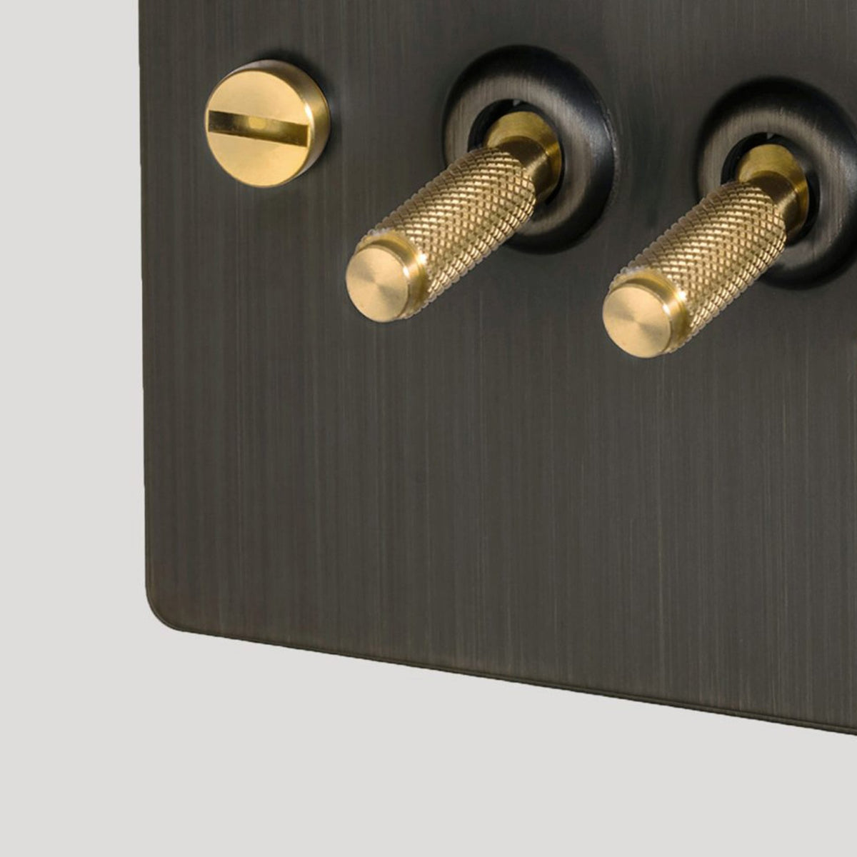 Four Gang 2-Way Light Switch in Smoked Bronze & Brass with Knurled Toggles