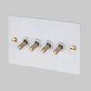 Four Gang 2-Way Light Switch in White & Brass with Knurled Toggles