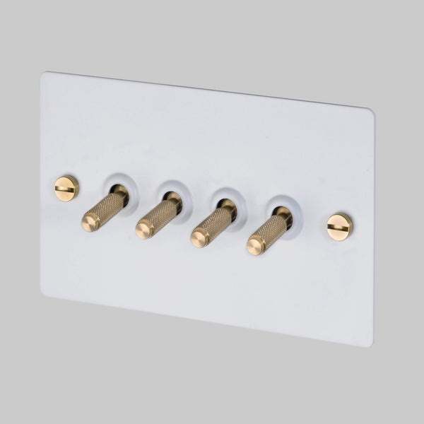 Four Gang 2-Way Light Switch in White & Brass with Knurled Toggles