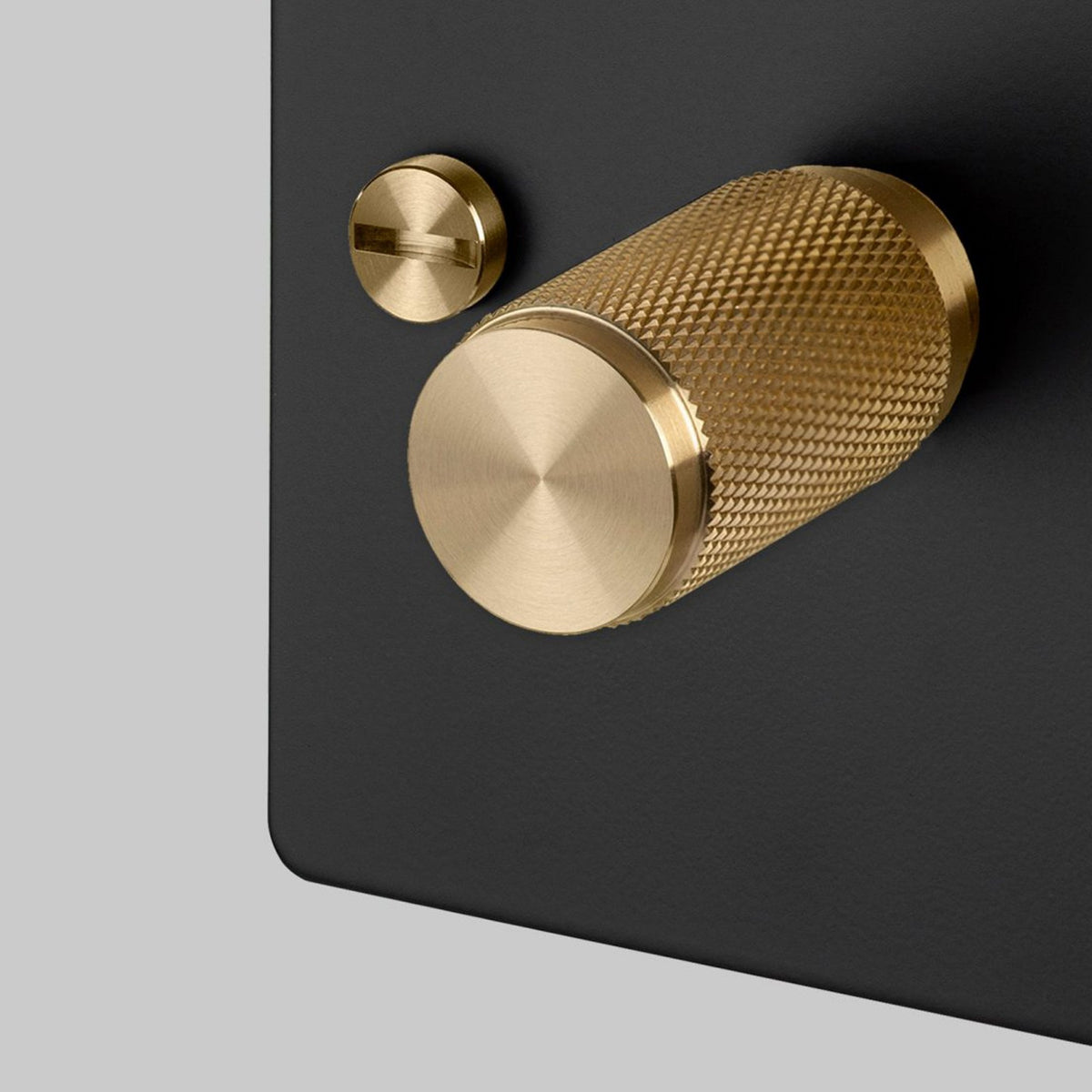 One Gang 2-Way Dimmer Light Switch in Black & Brass with Knurled Knob