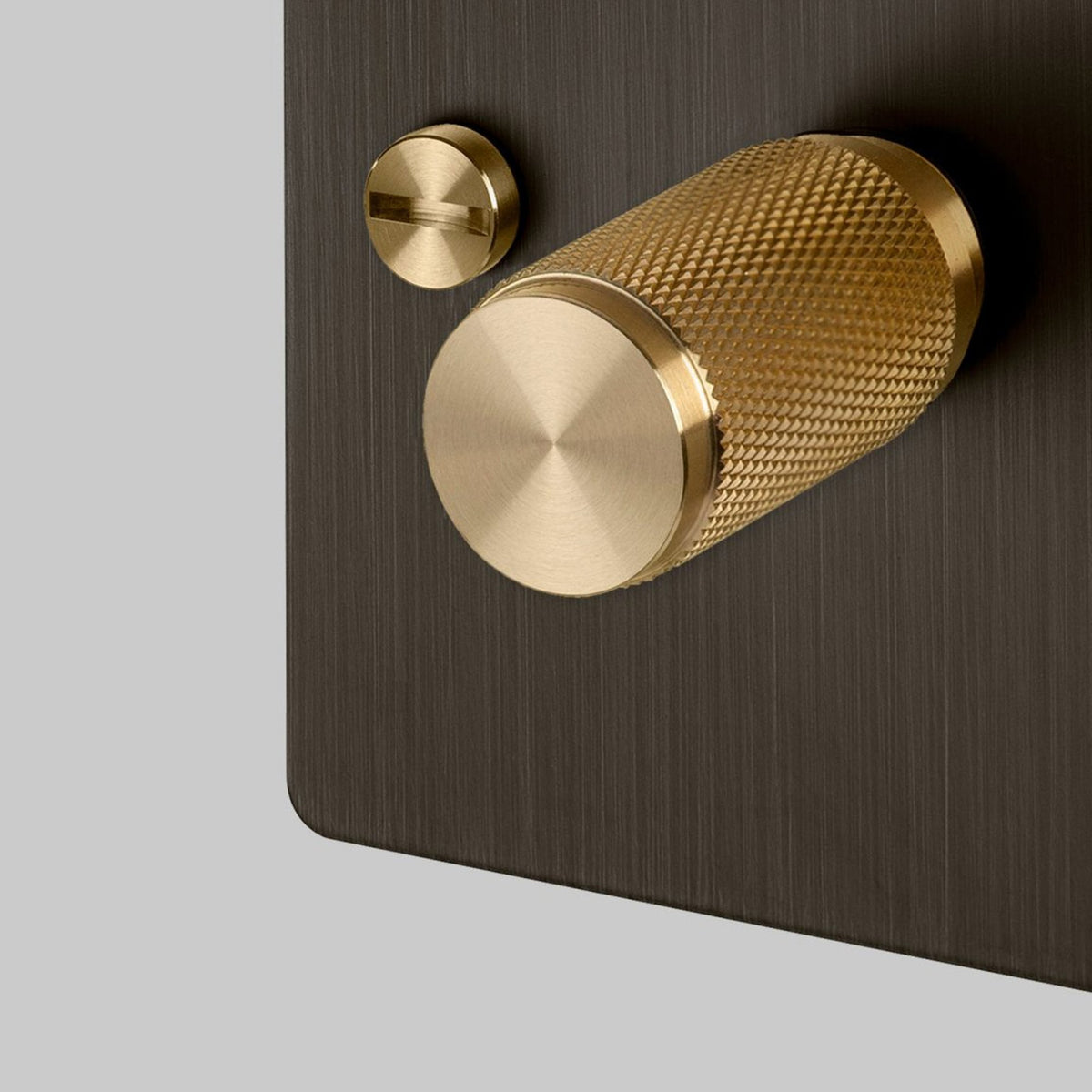 One Gang 2-Way Dimmer Light Switch in Smoked Bronze & Brass with Knurled Knob