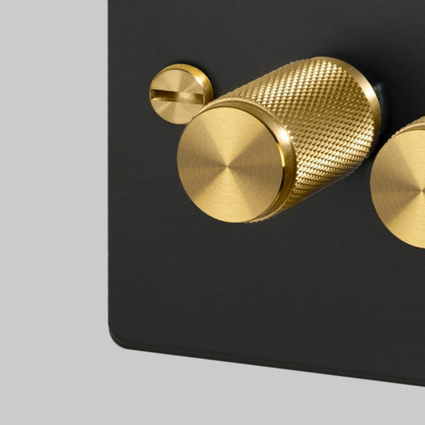 Three Gang 2-Way Dimmer Light Switch in Black & Brass with Knurled Knobs