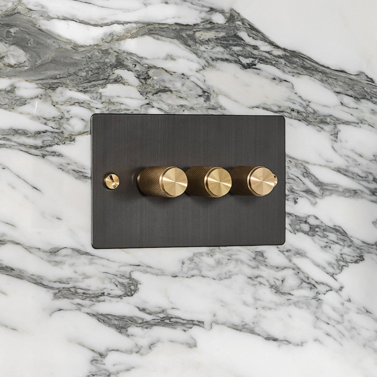 Three Gang 2-Way Dimmer Light Switch in Smoked Bronze & Brass with Knurled Knobs