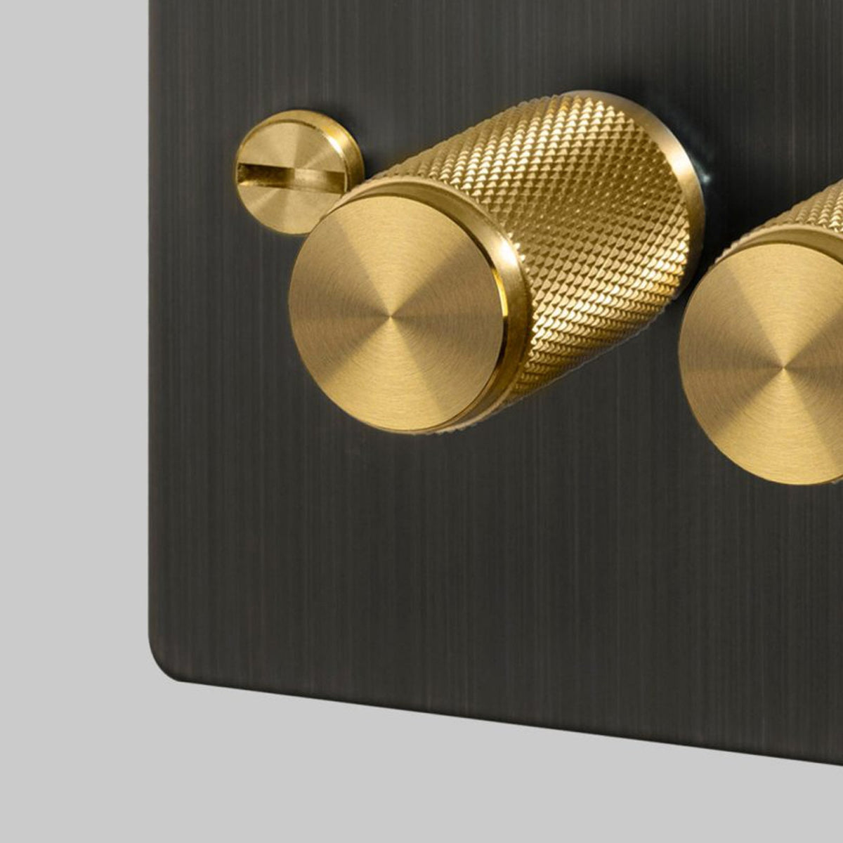 Three Gang 2-Way Dimmer Light Switch in Smoked Bronze & Brass with Knurled Knobs