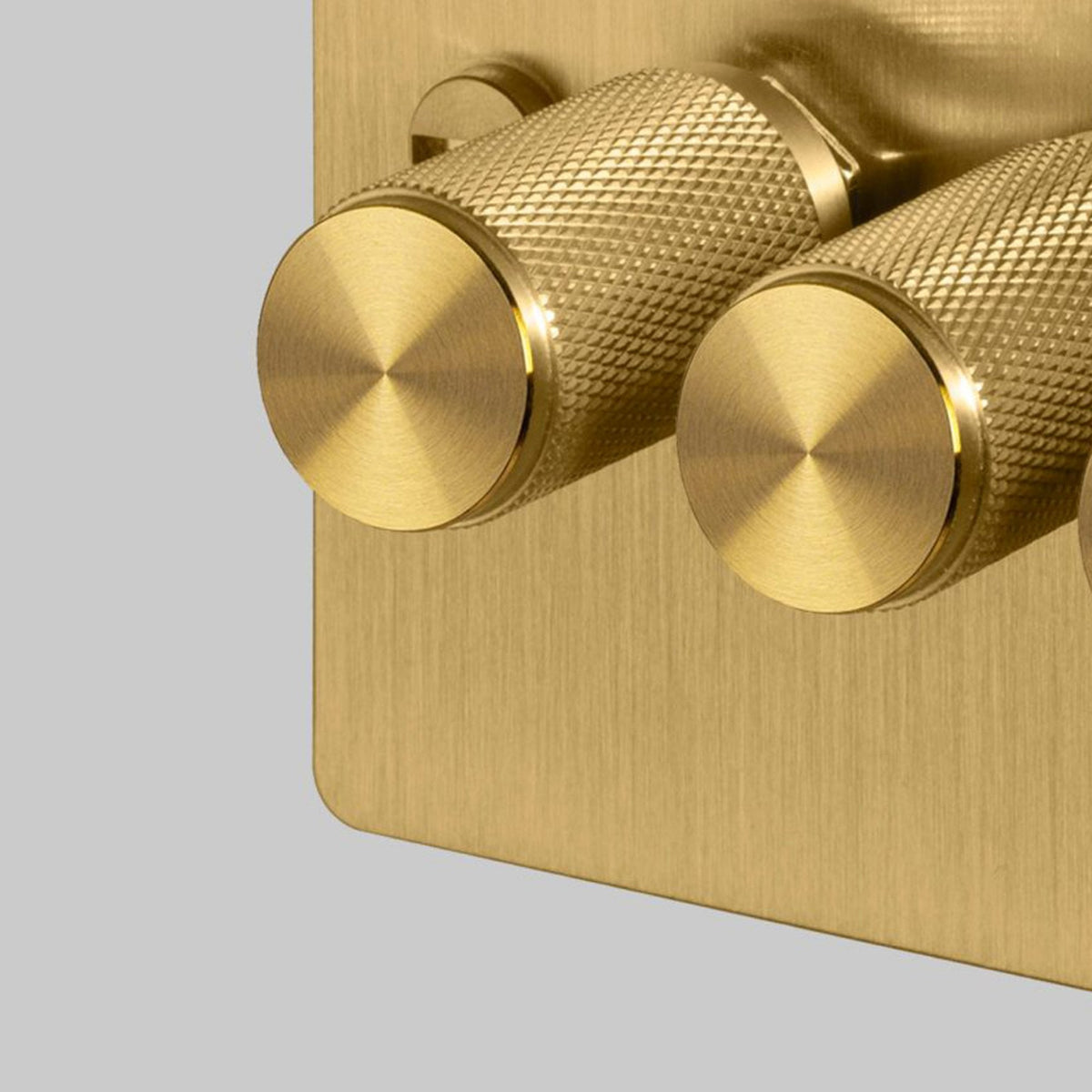Four Gang 2-Way Dimmer Light Switch in Solid Brass with Knurled Knobs