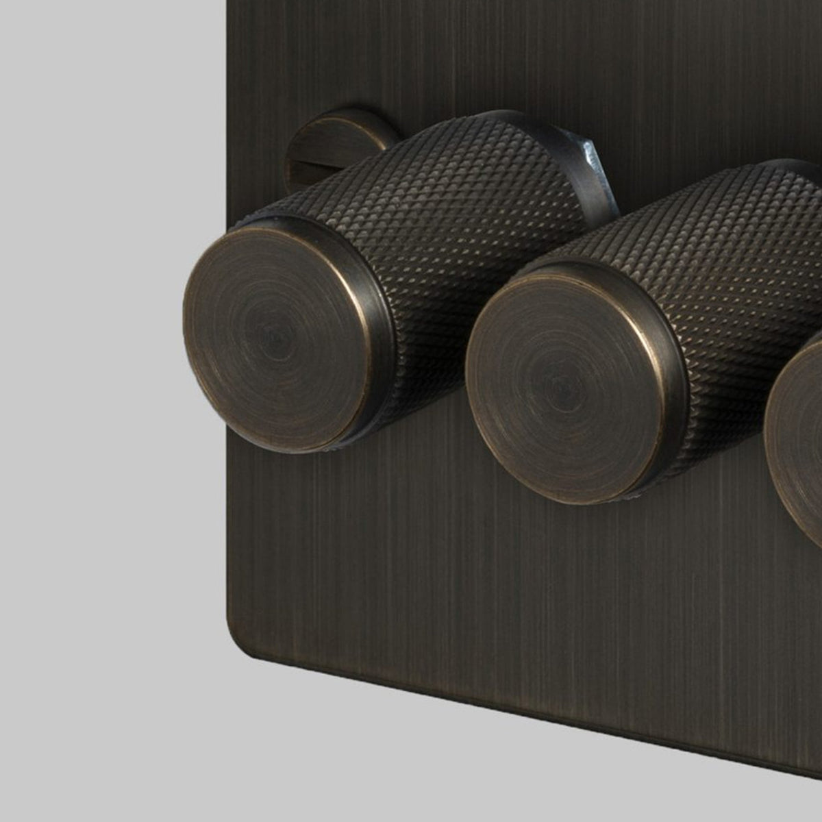 Four Gang 2-Way Dimmer Light Switch in Smoked Bronze with Knurled Knobs