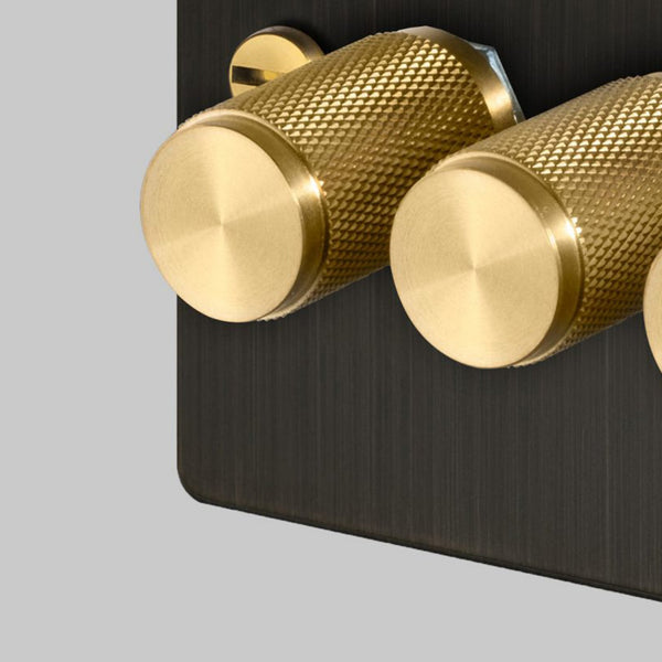Four Gang 2-Way Dimmer Light Switch in Smoked Bronze & Brass with Knurled Knobs