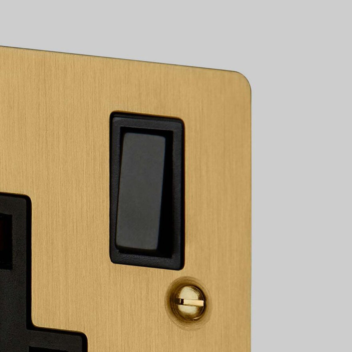 One Gang 13 Amp Switched Plug Socket In Solid Brass