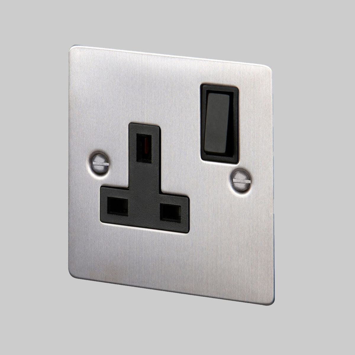 A close-up of a brushed stainless steel single socket with a black insert and switch.