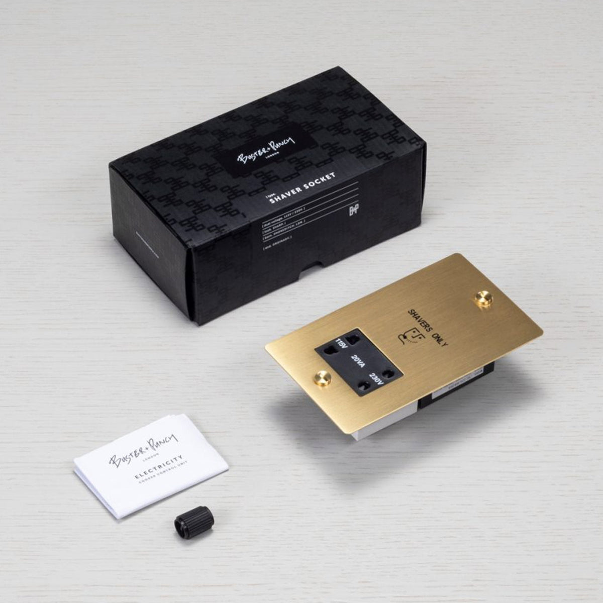 Buster + Punch shaver socket in brass, with black box packaging and instruction manual.